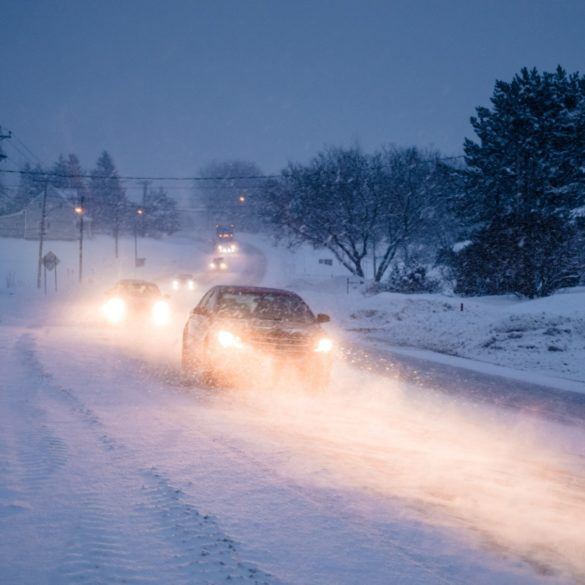 blizzard on the road during a cold winter evening P4QLUP3