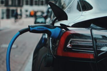 an electrtic vehicle charging at an ev charging station