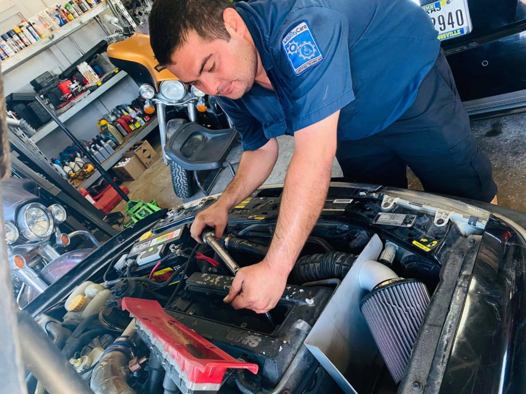 Jose Campos under the hood of his Saab. 